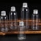 ClearGuard Refillable Travel Cosmetic Containers 50pcs Plastic Sample Bottles With Aluminum Caps 0