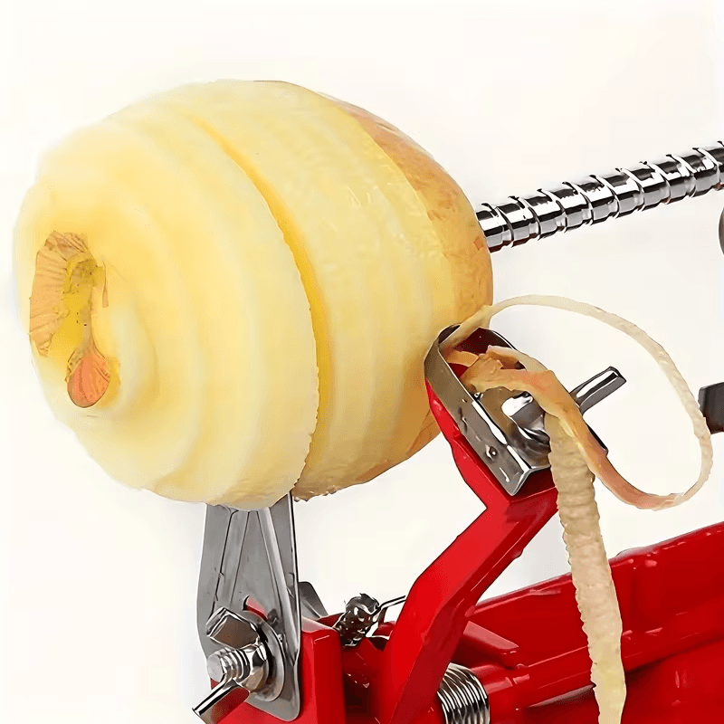 Apple corer slicer peeler in use on a fresh apple
