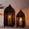 Elegant Black Metal Hanging Candle Lantern Set Hollow Pattern Ambient Decor 0