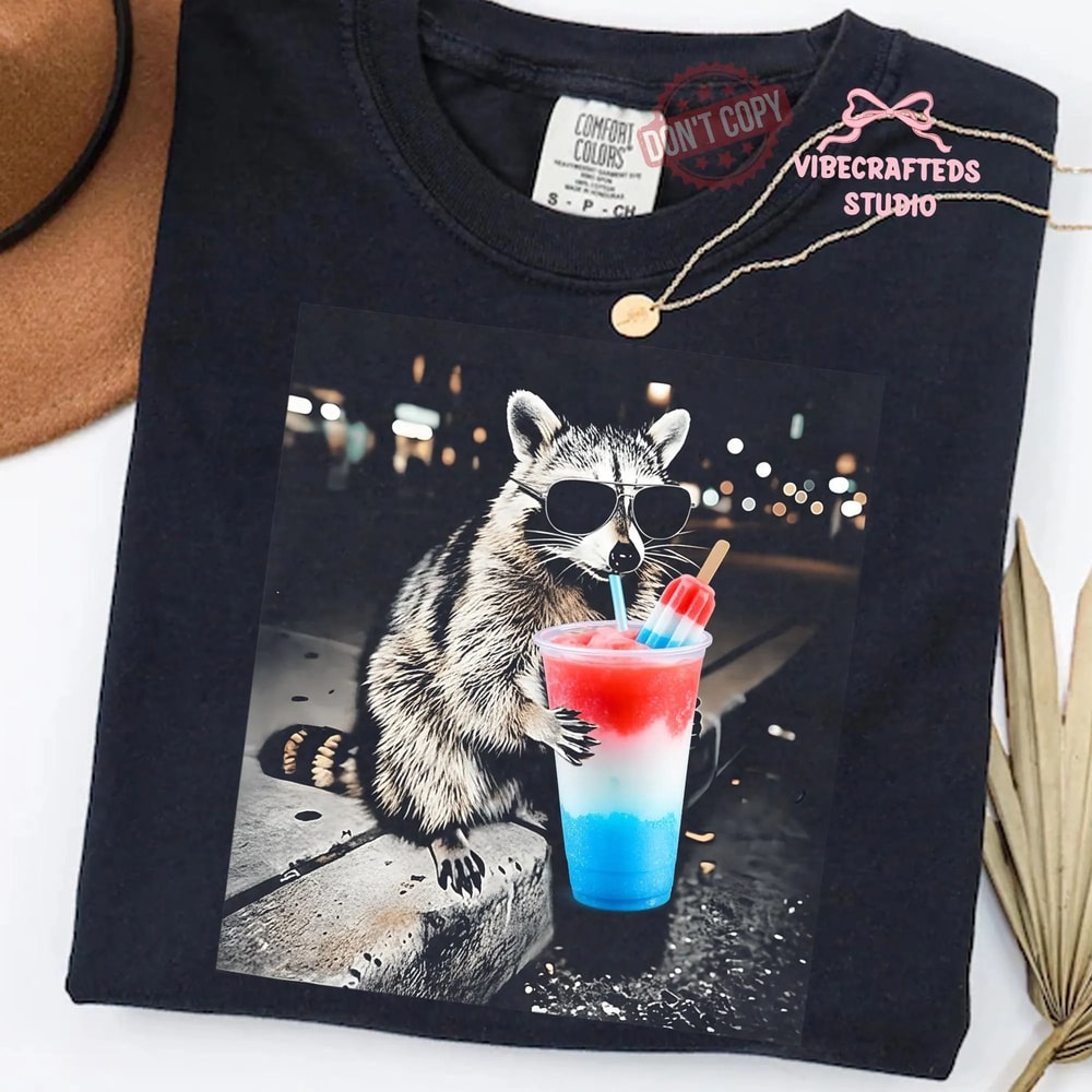 4th Of July Raccoon Drinking Patriotic Slushie Comfort Colors Funny Meme Shirt 0