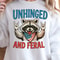 Unhinged And Feral Raccoon 4th Of July Funny Graphic Tee 1