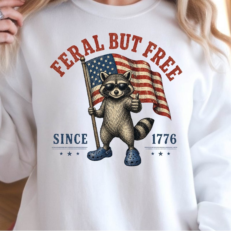 Feral But Free Raccoon 4th Of July Patriotic Graphic Tee 0