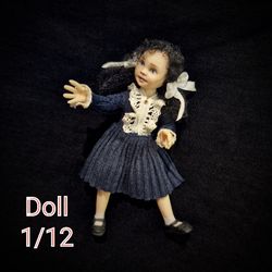 Miniature baby doll in 1/12 scale for the dollhouse.2