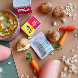 Miniature kitchen set for vegetable soup with cheese