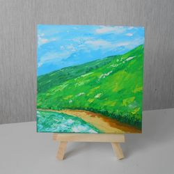 Mountains by the lake. Bright landscape with oil paints.
