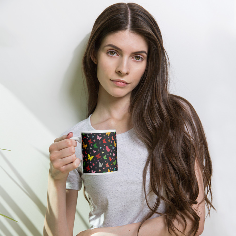 Rainbow colored butterflies on a dark background coffee mug