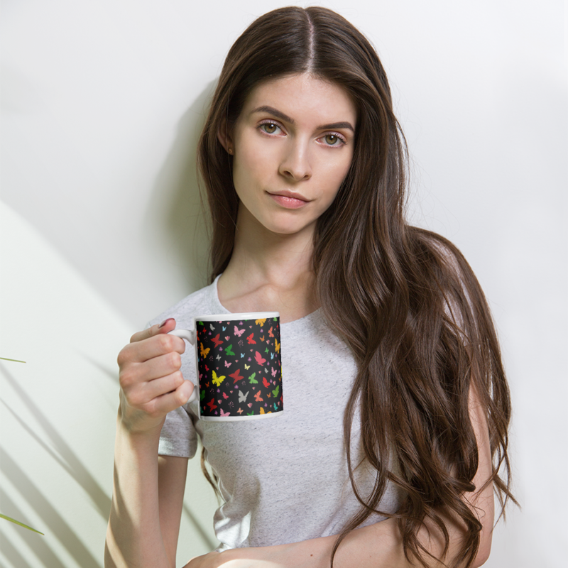 Rainbow colored butterflies on a dark background coffee mug
