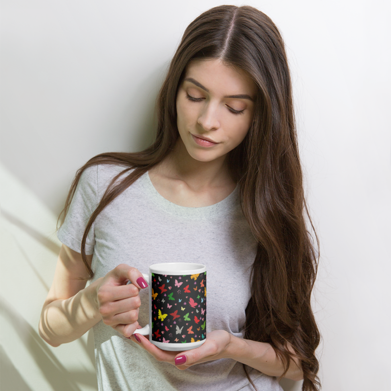 Rainbow colored butterflies on a dark background coffee mug