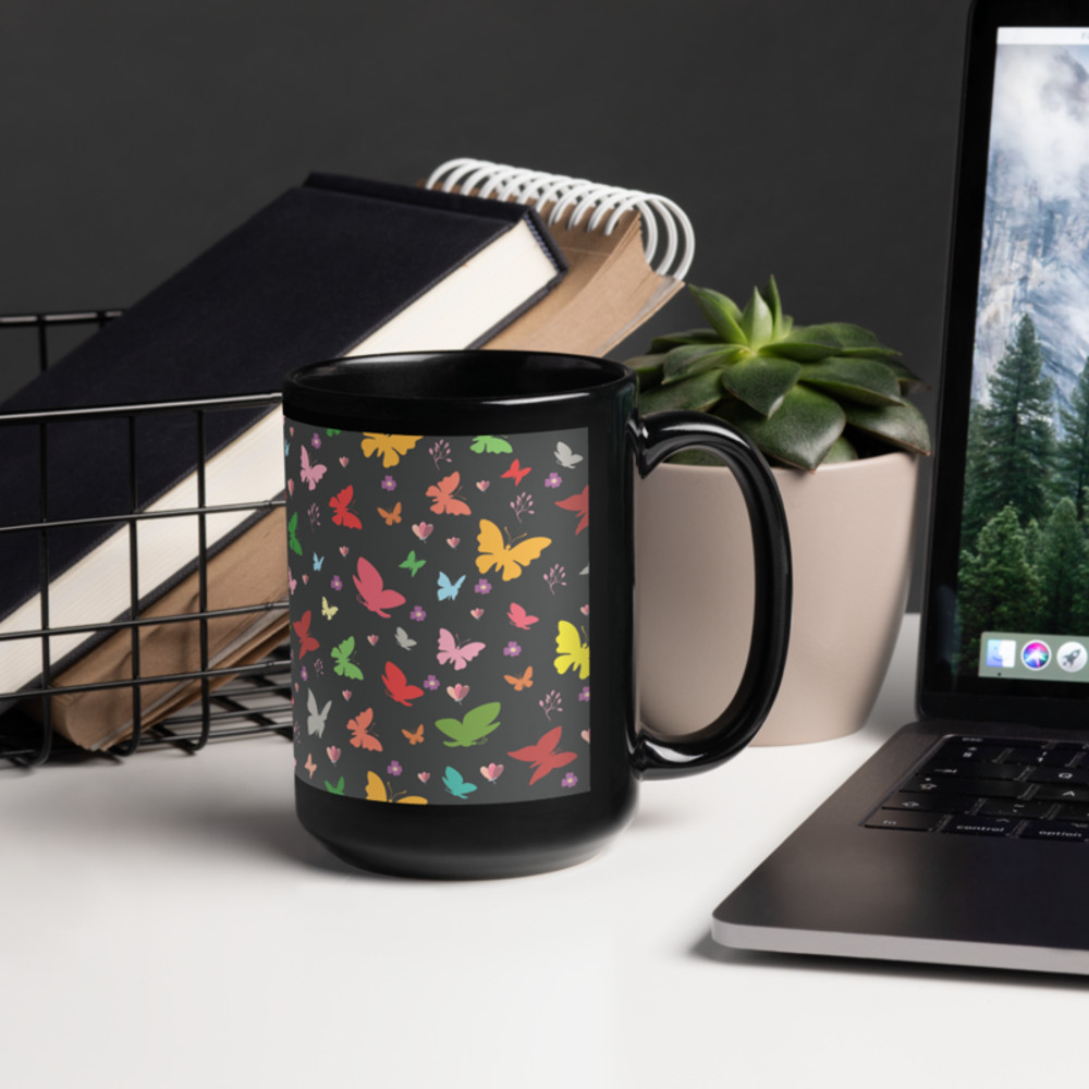 Rainbow colored butterflies on a dark background black glossy coffee mug