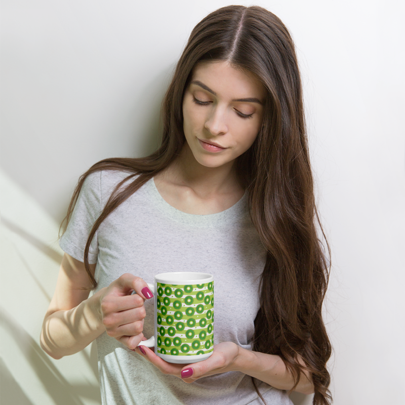 Kiwi slices on a striped background coffee mug