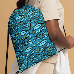leaves on a blue background drawstring bag