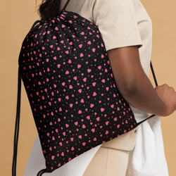 pink hearts on the black background drawstring bag