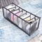 Lingerie storage boxes displaying neatly arranged undergarments in compartmentalized organizers