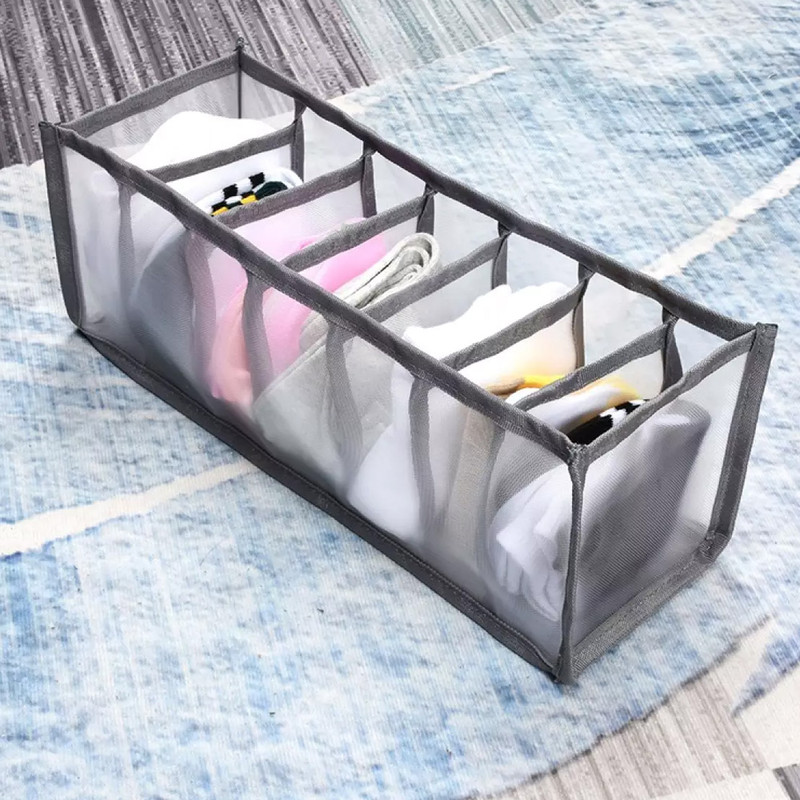 Lingerie storage boxes displaying neatly arranged undergarments in compartmentalized organizers