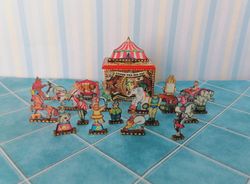 Box with circus figures. Dollhouse miniature.